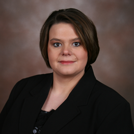 A woman is smiling at the camera