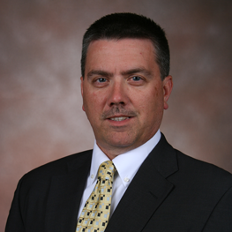A man wearing a suit and tie