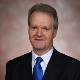 A man wearing a suit and tie