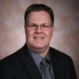 A man wearing a suit and tie