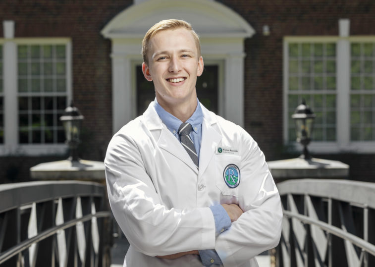 male medical student in white coat